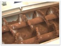 Cocoa powdering machine