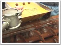 Cocoa powdering machine